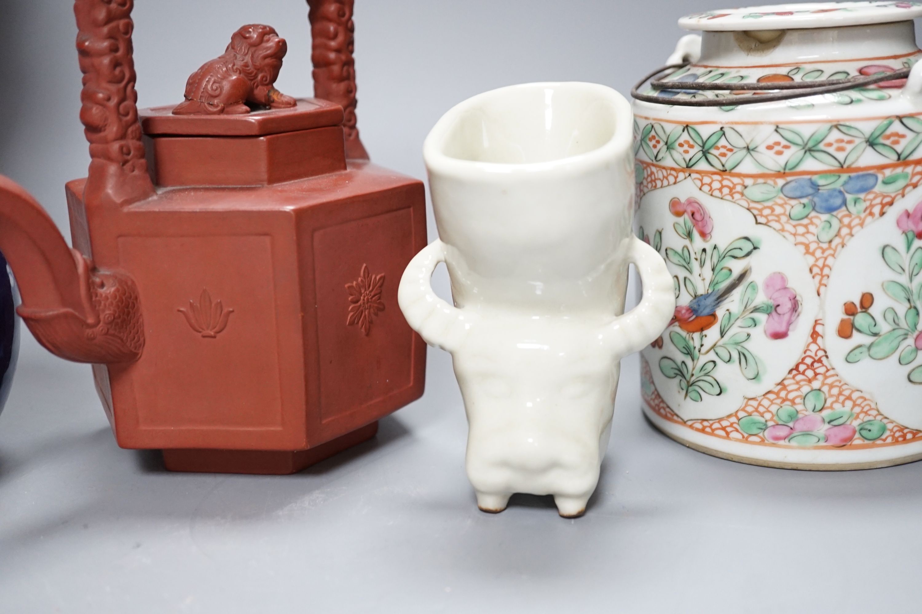 A Chinese blanc de chin figure of a lady with a bird, 37cm, together with a famille rose teapot, a yixing style teapot, blue and white jar and cover and a pale celadon ground ‘ox head’ libation cup
